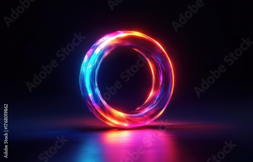 Glowing neon ring shape with swirling blue, pink, red, and orange colors emitting vibrant light on a dark reflective surface, creating a futuristic and mesmerizing effect