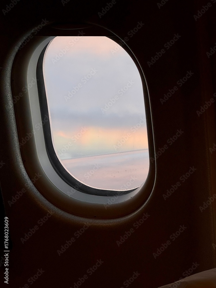 Naklejka premium Rainbow clouds from airplane