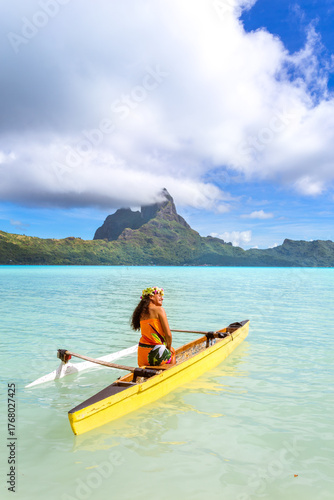 Local woman on outrigger canoe, Bora Bora, French Polynesia
