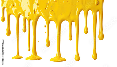 Dripping, viscous yellow substance; opaque liquid flow against dark backdrop