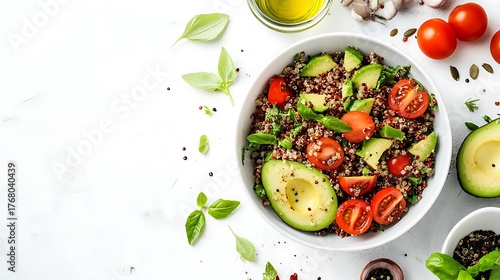 Quinoa salad with avocado, tomatoes, parsley, and olive oil isolated on white background