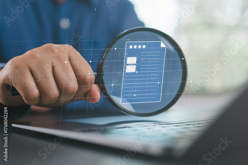 Businessman inspection paperwork with magnifier. A business analysis concept.