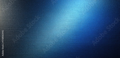 Abstract blue metal surface with brushed texture and gradient light effects
