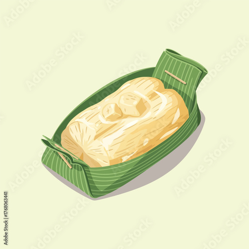 Traditional Asian dessert wrapped in fresh green banana leaf.