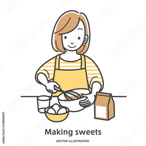 お菓子作りをする若い女性