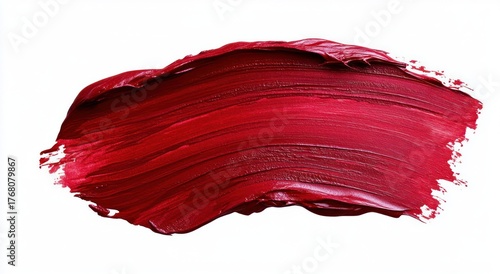 thick brush stroke of vibrant red paint on white background with textured surface and visible brush marks