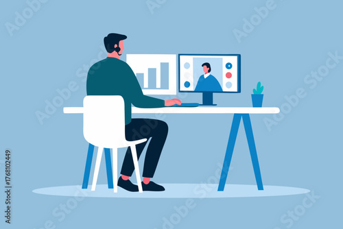 Man working at a desk with two computer monitors one showing a bar graph and the other a video call