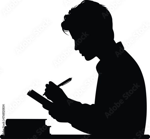 Man diligently taking notes and studying at a desk with books and papers