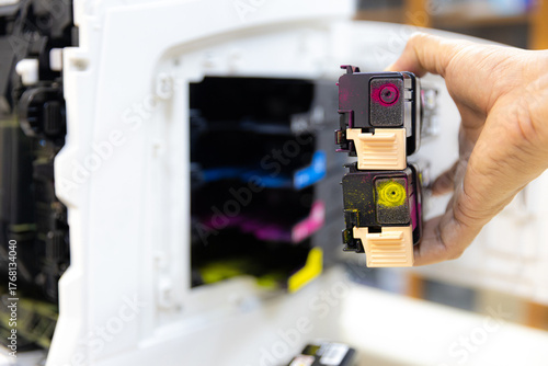 Technician Holding ink printer toner low for replace new or fix repair problem paper or print scanning fax or copy document or photocopier or photocopy office workplace equipment concept