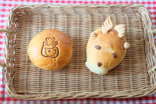 Reindeer shaped bread and bear illustration bread in the basket
