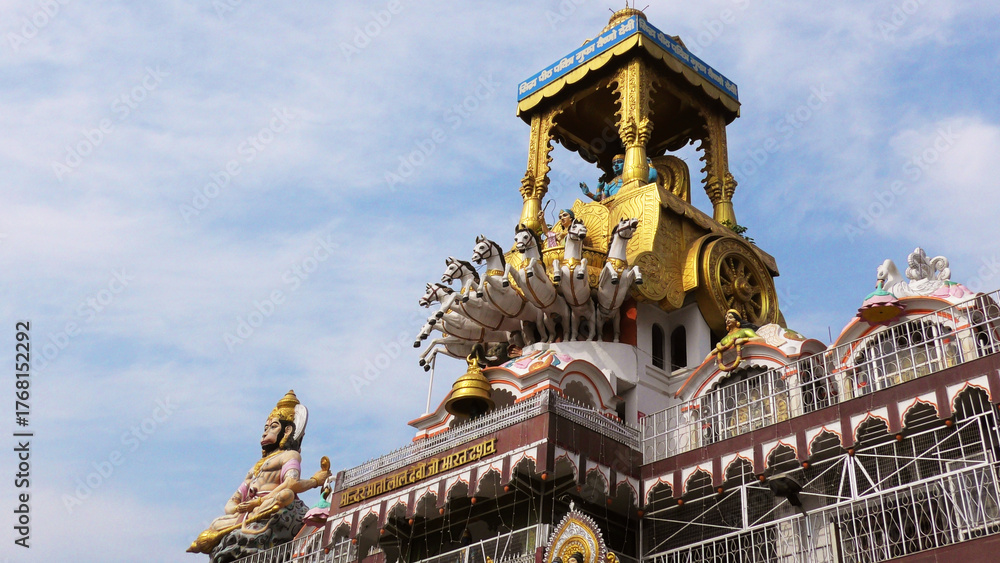 Fototapeta premium Colorful mythological sculptures seen on the arch building of Vaishno Devi Temple, Haridwar, Uttarakhand, India