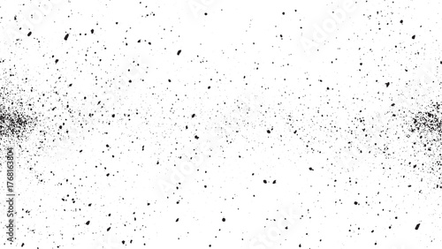 Black speckles scattered across white background dots spots