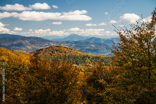 Fototapeta Naklejka Na Ścianę i Meble -  The mountains are covered in trees and the sky is cloudy - vew from Wielka Racza in Beskids Mountains, Poland.