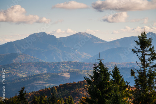 Fototapeta Naklejka Na Ścianę i Meble -  The mountains are covered in trees and the sky is cloudy - vew from Wielka Racza in Beskids Mountains, Poland.