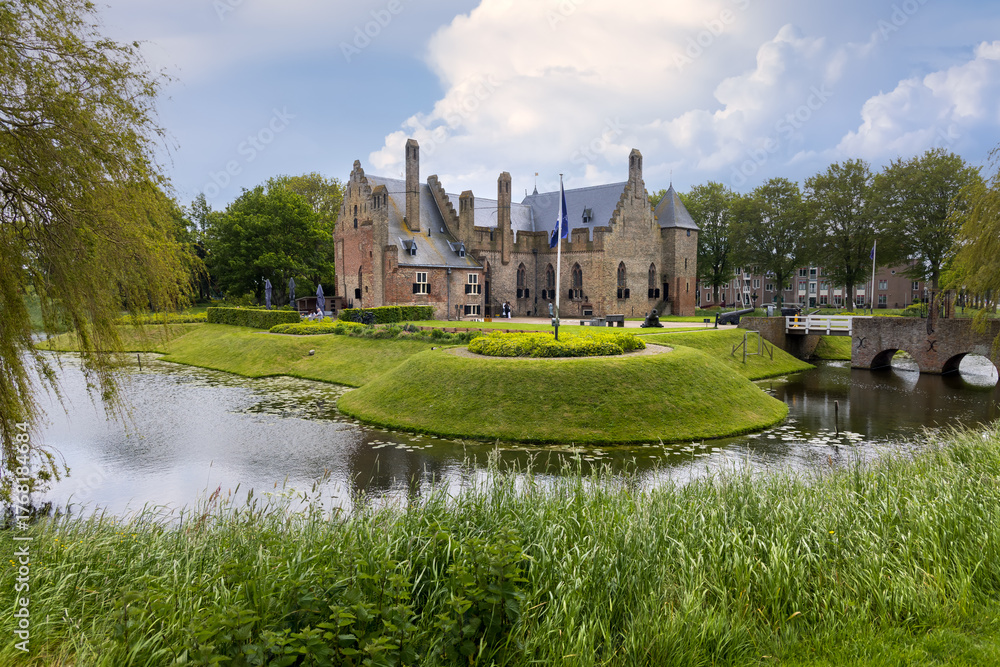 Obraz premium Historic Radboud castle in Medemblik city on the island in The Netherlands during spring time.