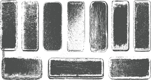 A collection of grey rectangular shapes with various distressed and textured appearances on a white background.