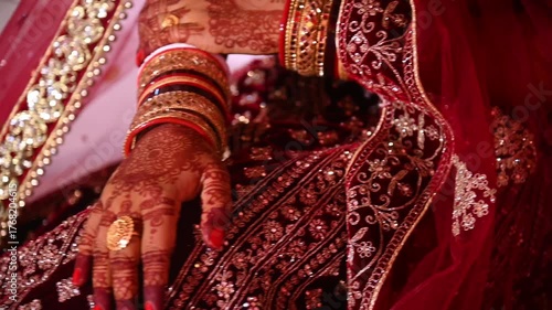 A cinematic close-up of a traditional Indian wedding ceremony, showing a couple dressed in ornate red attire and garlands, celebrating sacred rituals that symbolize union and rich cultural heritage.