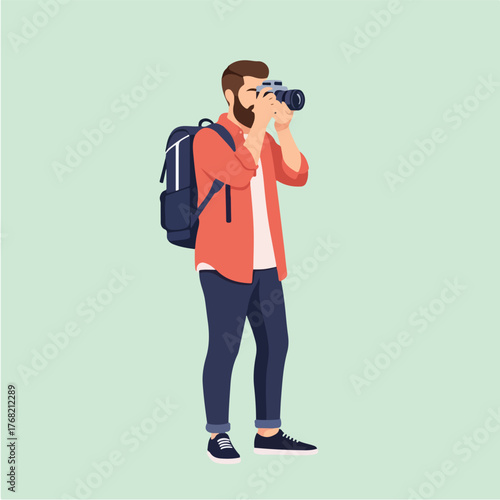 Bearded man with backpack takes photo in studio using professional camera, capturing a moment with focus and precision, showcasing modern lifestyle.