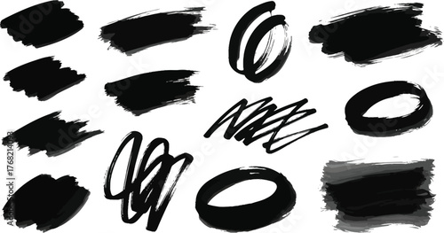 Collection of diverse black ink brush strokes and paint splatters on a white background