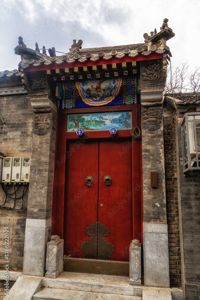 Fototapeta premium Traditional old style richly decorated house in street in Xi Cheng Hutong District