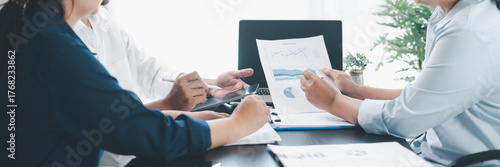 Panorama of corporate teamwork with people discussing financial reports, pointing at charts, planning business strategy, analyzing data and collaborating in office meeting for professional success.