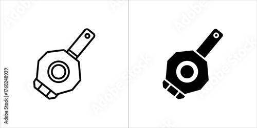 Two icons of a mechanical component, one outlined and one solid black