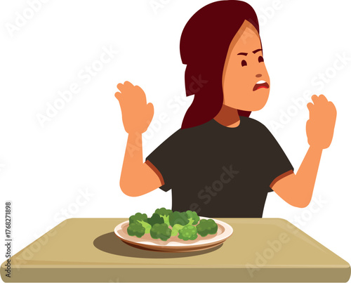 Child refusing to eat healthy green vegetables expressing disgust for broccoli served on a plate