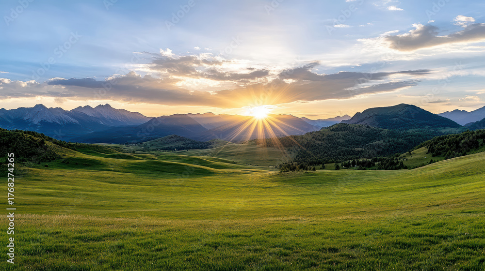 Fototapeta premium Golden sunset illuminates green hills and mountains, creating serene landscape