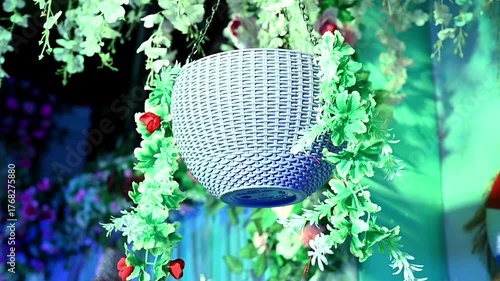 Vibrant garlands in various colors, hang beautifully as traditional Indian wedding decorations, creating a festive floral backdrop for celebration and temple entrance adornment.