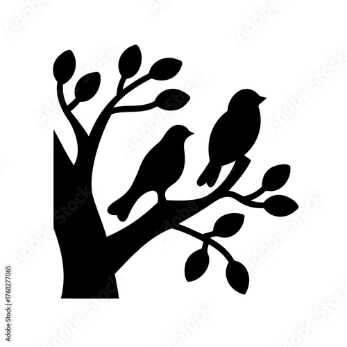 Silhouette of two birds perched on a tree branch with budding leaves