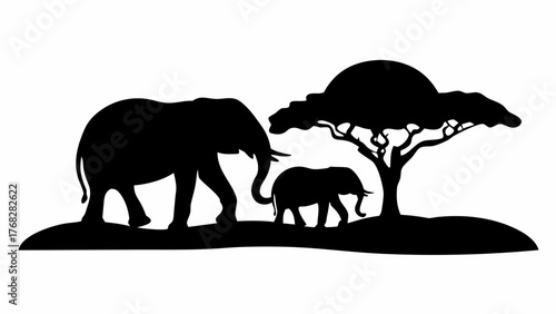 Elegant elephant family silhouette walking gracefully near a tree on the African savanna lands