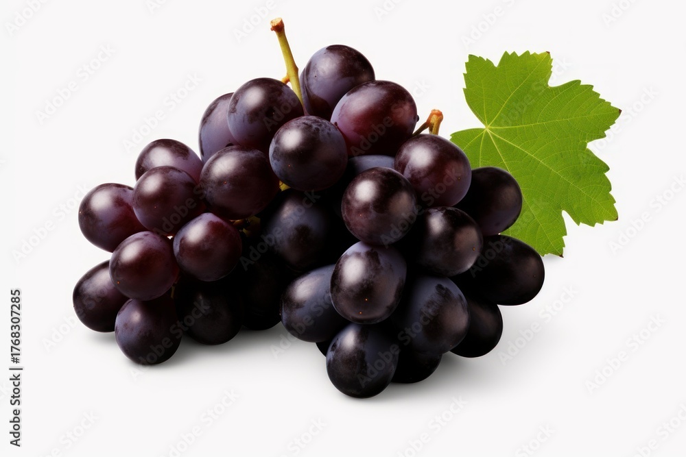Fototapeta premium Ripe black grapes with green leaves create a vibrant display against a white backdrop