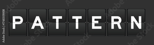 Black color analog flip board with word pattern on gray background