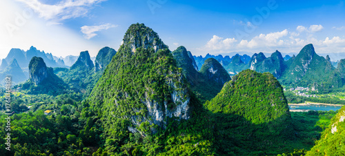 Fototapeta Naklejka Na Ścianę i Meble -  Aerial view of the beautiful green karst mountain and forest natural landscape in Guilin, China.