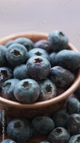 Wallpaper Mural Close-Up of Wild Blueberries in a Copper Bowl on a Wooden Surface	 Torontodigital.ca
