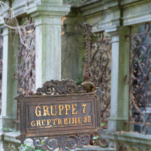 old information board on abandoned cementary