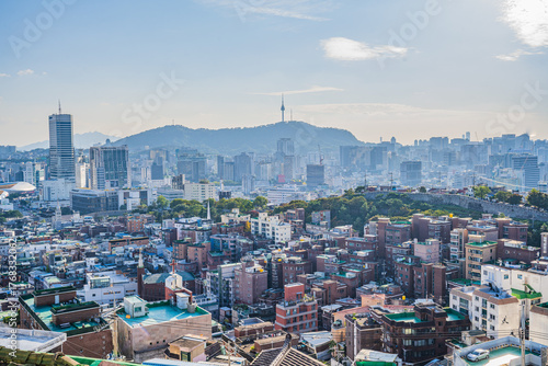 Photography Seoul's Namsan Tower and its surrounding cityscape during the autumn day