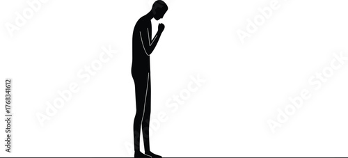 Silhouette of a sad man standing alone with bowed head expressing loneliness, depression, and emotional pain