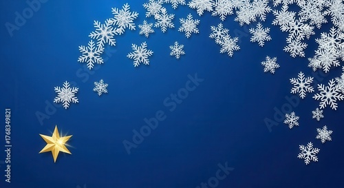 Winter holiday background with white snowflakes and a golden star. Festive Christmas and New Year concept on a blue backdrop with copy space