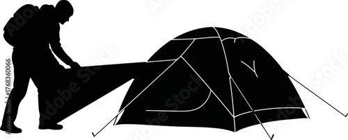 adventures foundation hiker pitches tent, readying for nights embrace