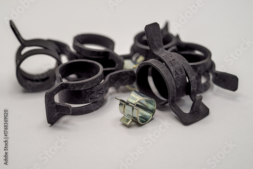 Photo of steel black clamps on a white background