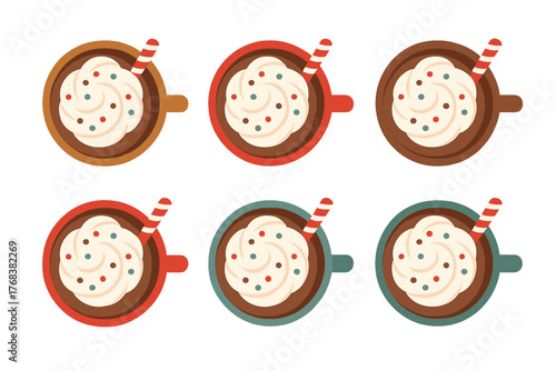 Colorful hot cocoa mugs with whipped cream and candy canes arranged in a pattern