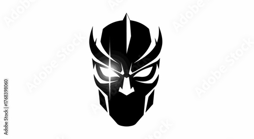 A striking black and white graphic illustration of a stylized, futuristic mask with glowing eyes.