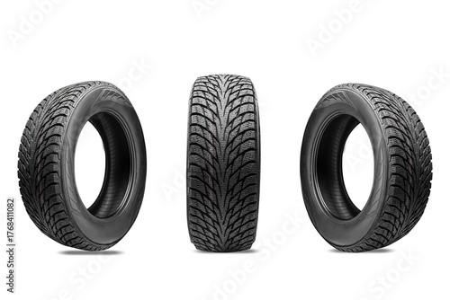 Three winter tires without spikes, with a friction winter compound and multiple slats for effective braking on ice, on a white transparent background. Presentation of winter wheels during the tire