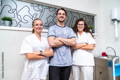 Physiotherapy team smiling with patient in clinic