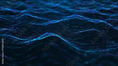 Abstract, undulating, digital landscape of blue and purple light particles on a dark background