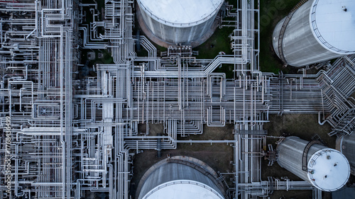 Obraz na plátně Aerial top view of oil and gas petrochemical storage tank and pipeline steel, Oil and gas transportation system pipeline steel at oil and gas refinery industry chemical plant, Pipeline oil and gas