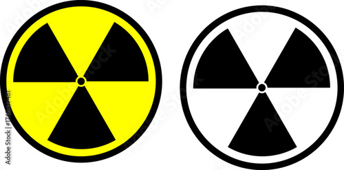Two radiation warning symbols one in yellow and black the other in black and white represent potential hazards and safety precautions