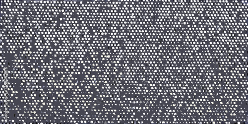 Abstract dark grey background with a pattern of small white dots and irregular shapes