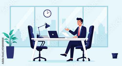 Businessman in a suit sitting at a desk in a modern office with a laptop, paperwork, and other office supplies.